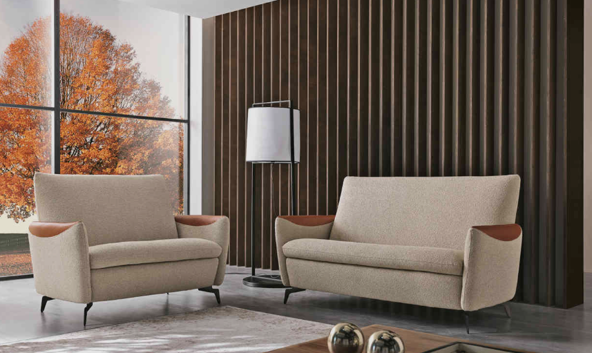 Beige Kilt Chair by MaxDivani, dark arms, angled metal legs.