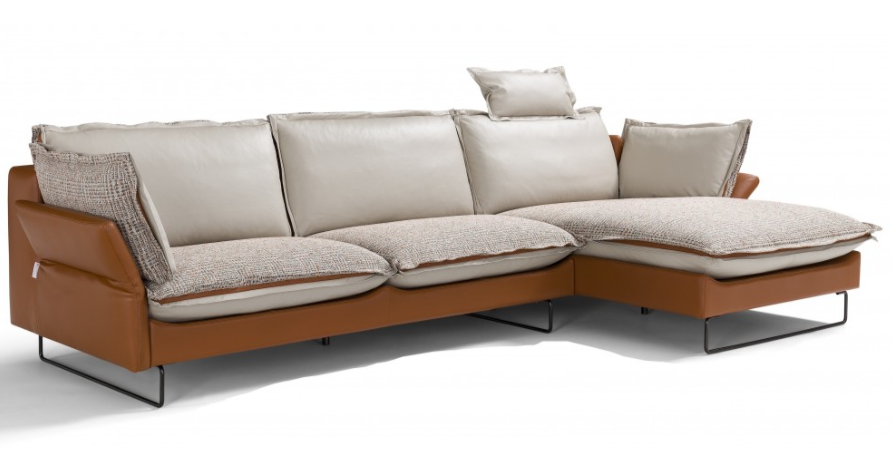 Brown and beige sectional sofa with cushions and chaise lounge.