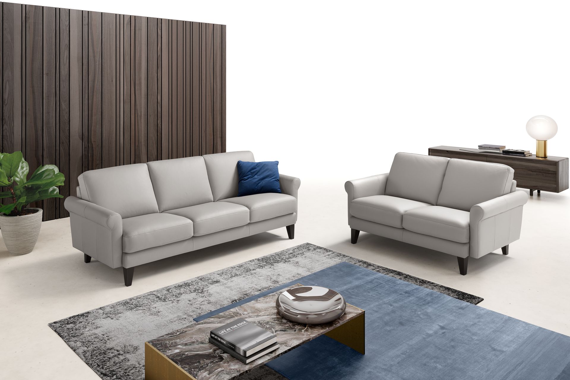 Light gray three-seat sofa on a white background.