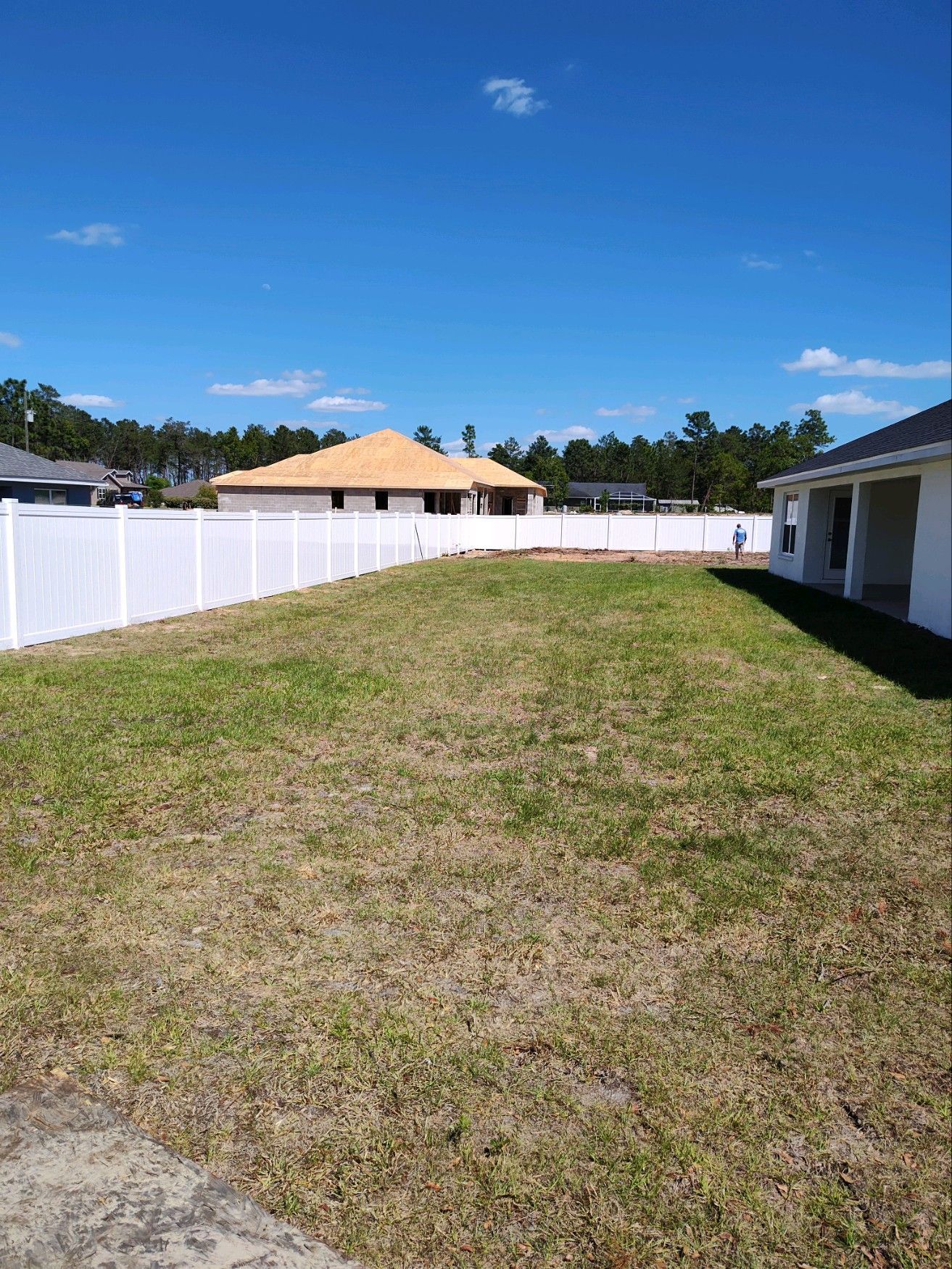 Residential privacy vinyl fence installation - inside view