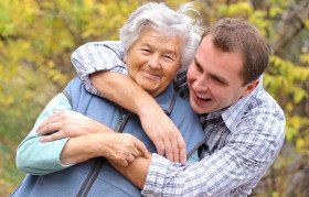Man hugging grandmother