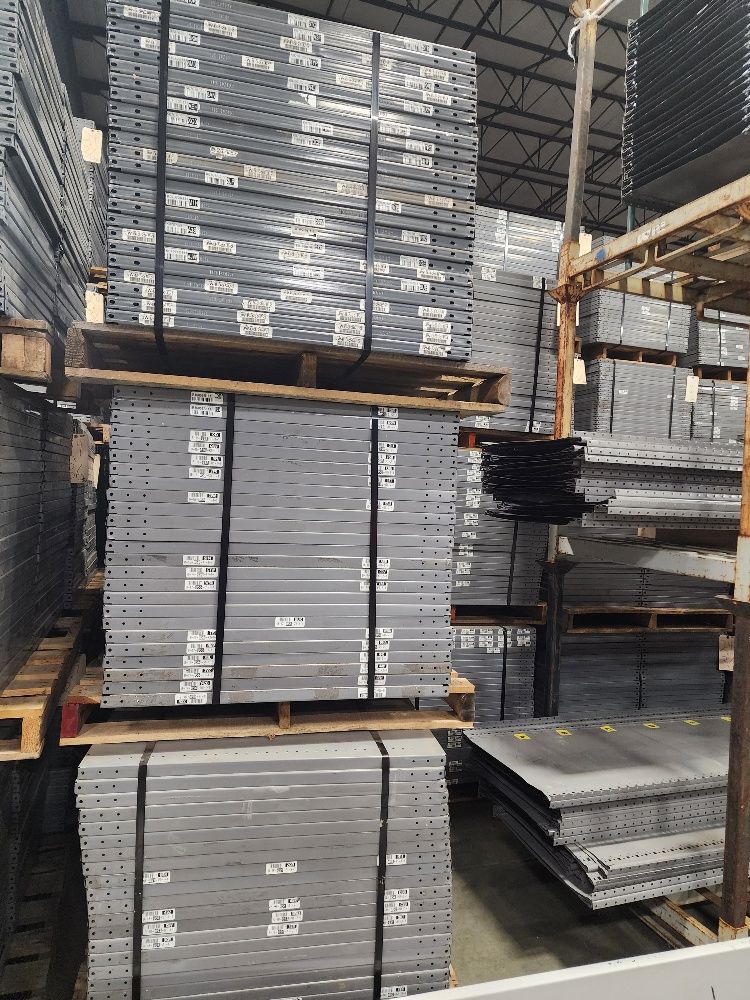 A warehouse filled with lots of pallets stacked on top of each other