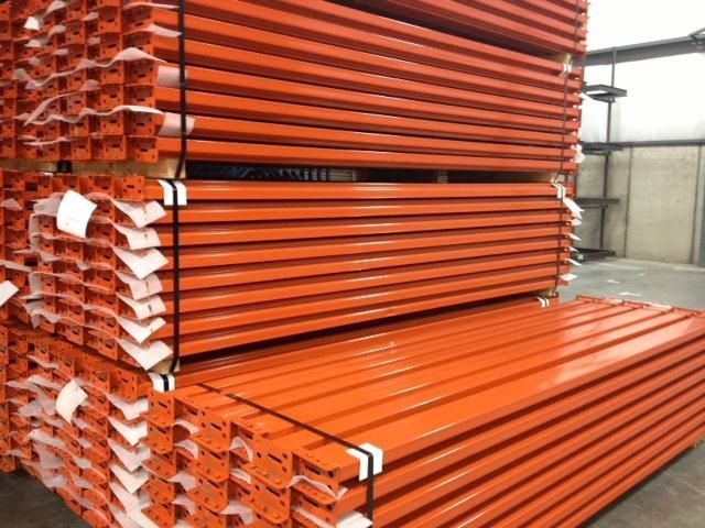 A bunch of orange pipes stacked on top of each other