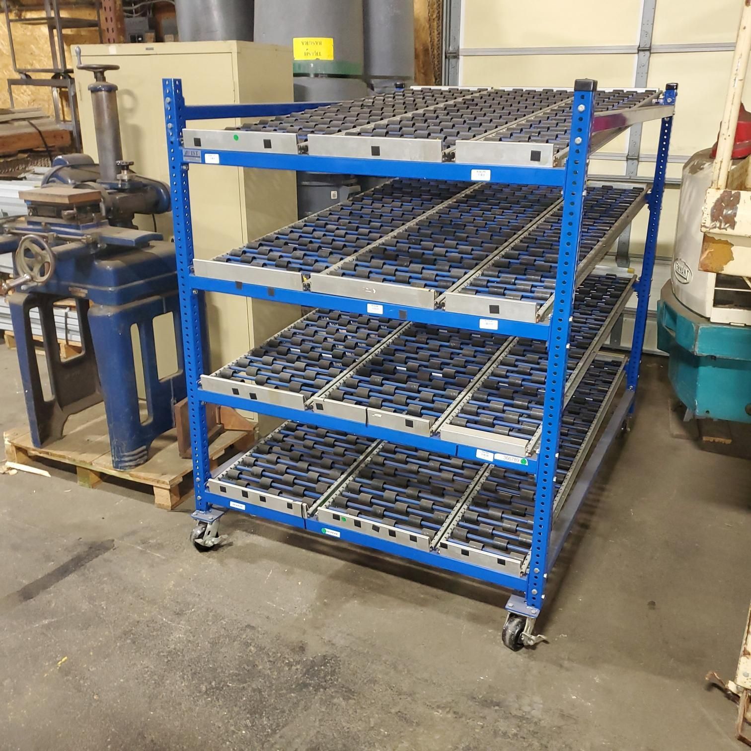 A blue shelf with a lot of shelves and wheels