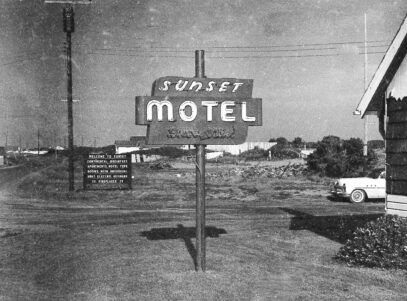 Sign for Sunset Motel, black and white photo.
