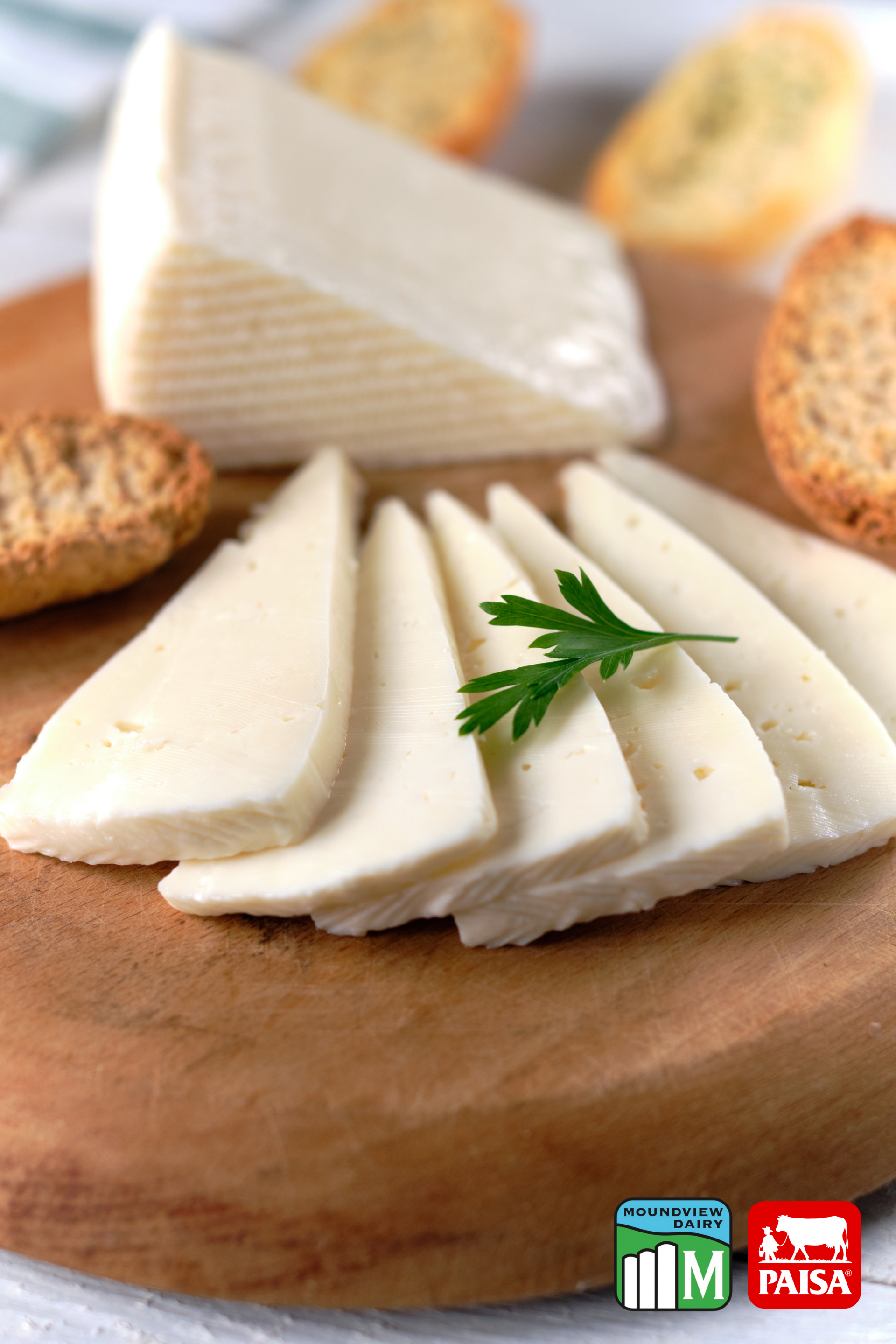 A stack of different types of cheese on top of each other.