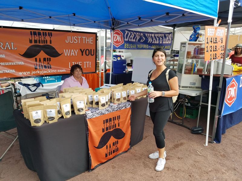 A table with a sign that says jerky jack on it