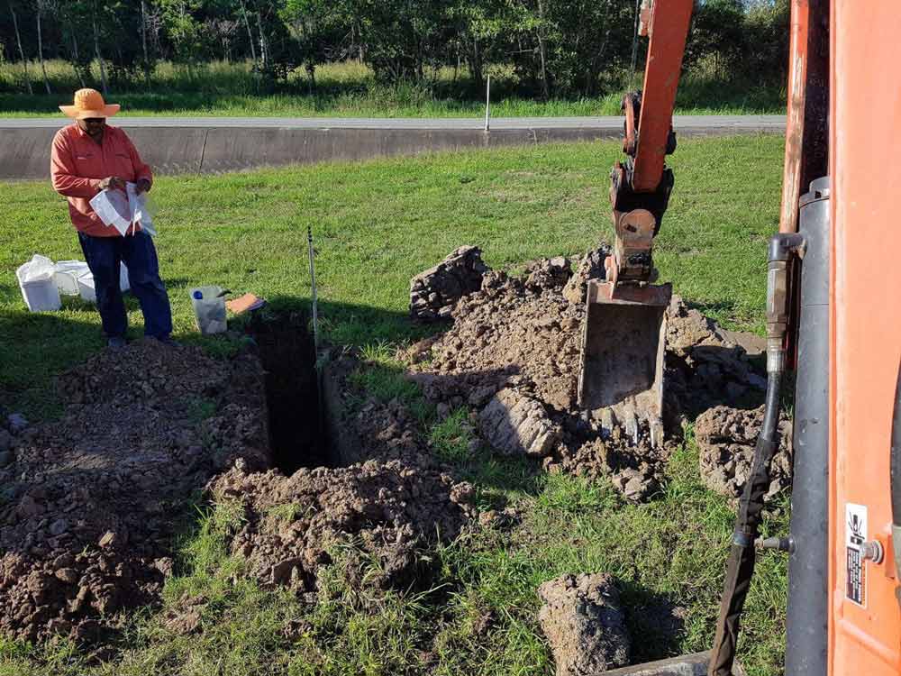 Digging Soil For Drainage Installation — Drainage in Townsville QLD