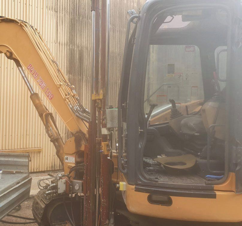 Orange Excavator — Rubbish Removal in Townsville QLD