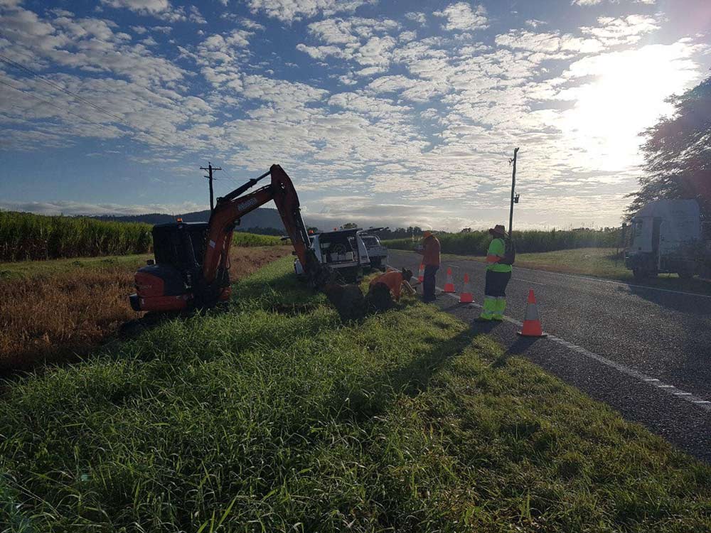 Excavator On Side Of Road — Excavation in Townsville QLD
