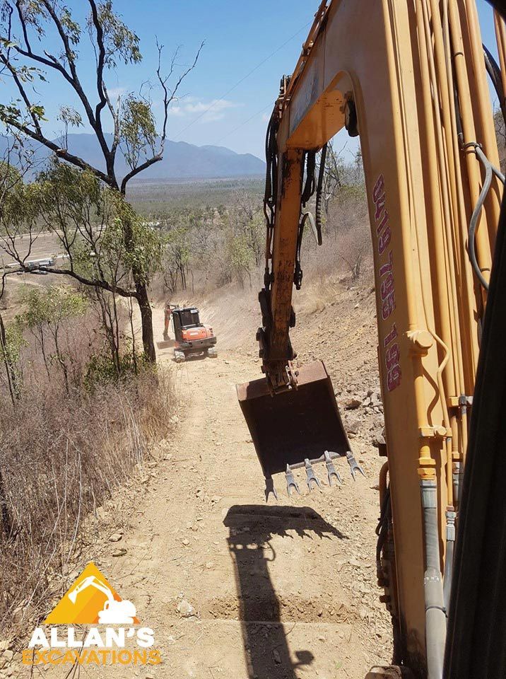 Excavator Digging Soil — Earthworks in Townsville QLD