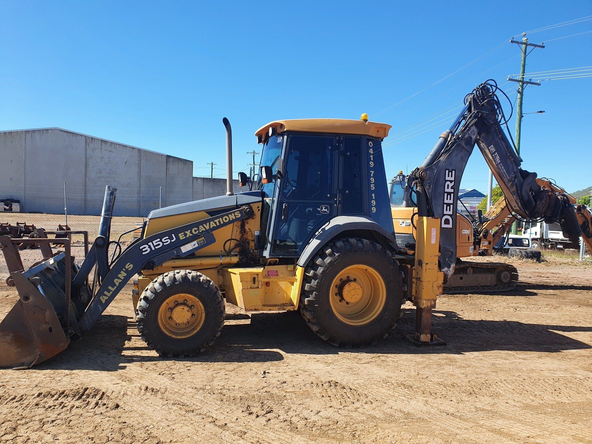Excavator In Car Park — Excavation in Townsville QLD