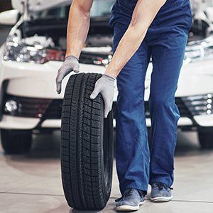 mechanic changing car tyre