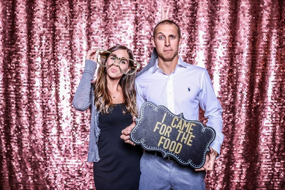 a couple posing at an astro Photo Booth rental in Austin, TX