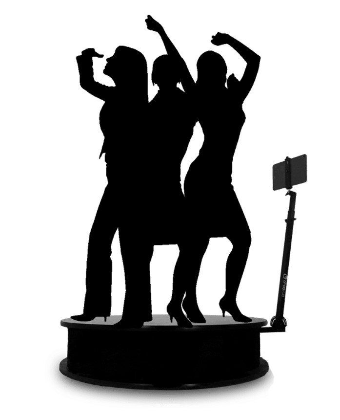 Silhouette of three girls using a 360 photo booth