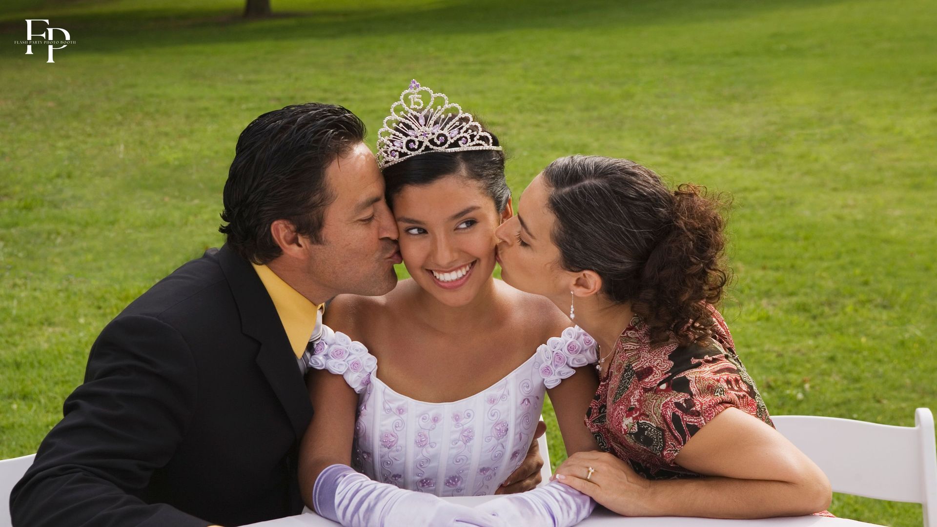 Quinceañera receives kisses from parent in San Jose.
