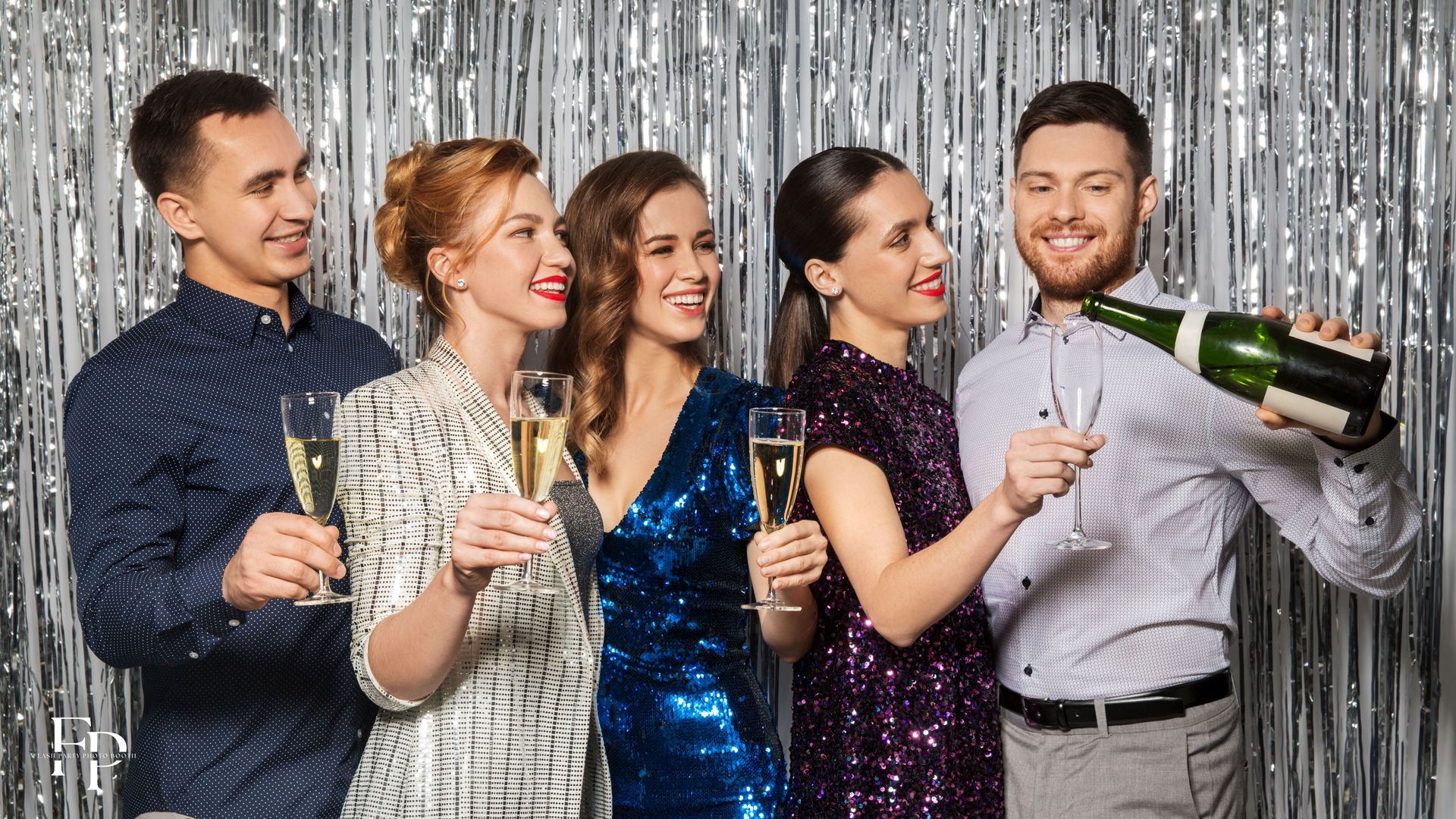 Five friends with drinks in hand at a sparkly photo booth backdrop in North Austin