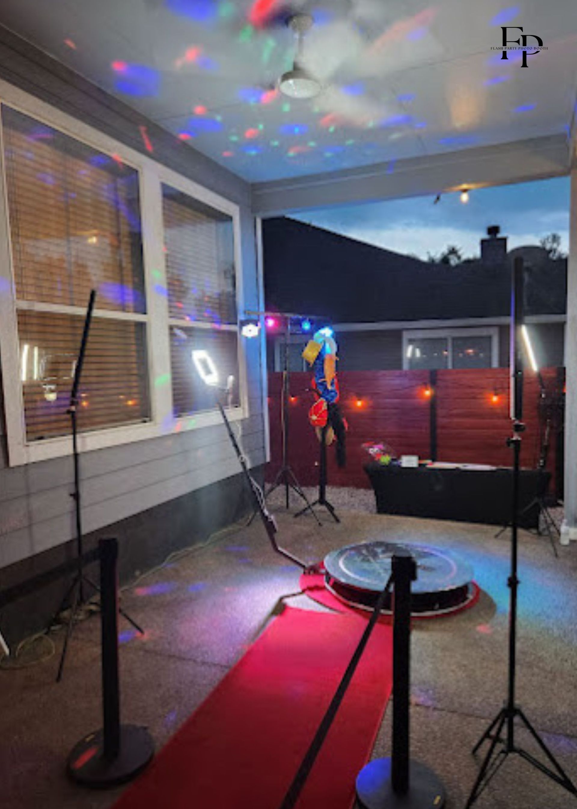 A stage set up with lights and Mirror Photo Booth.