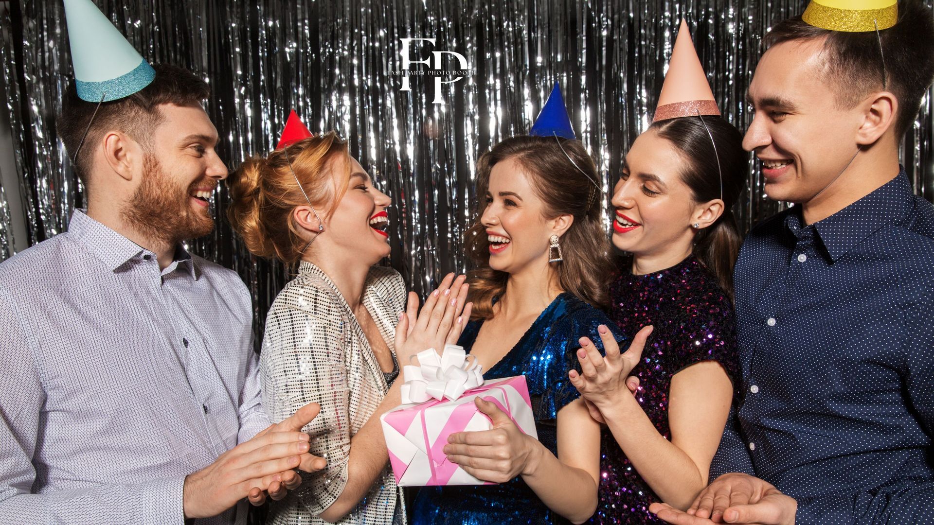 A group of friends posing and having fun at a photo booth rental