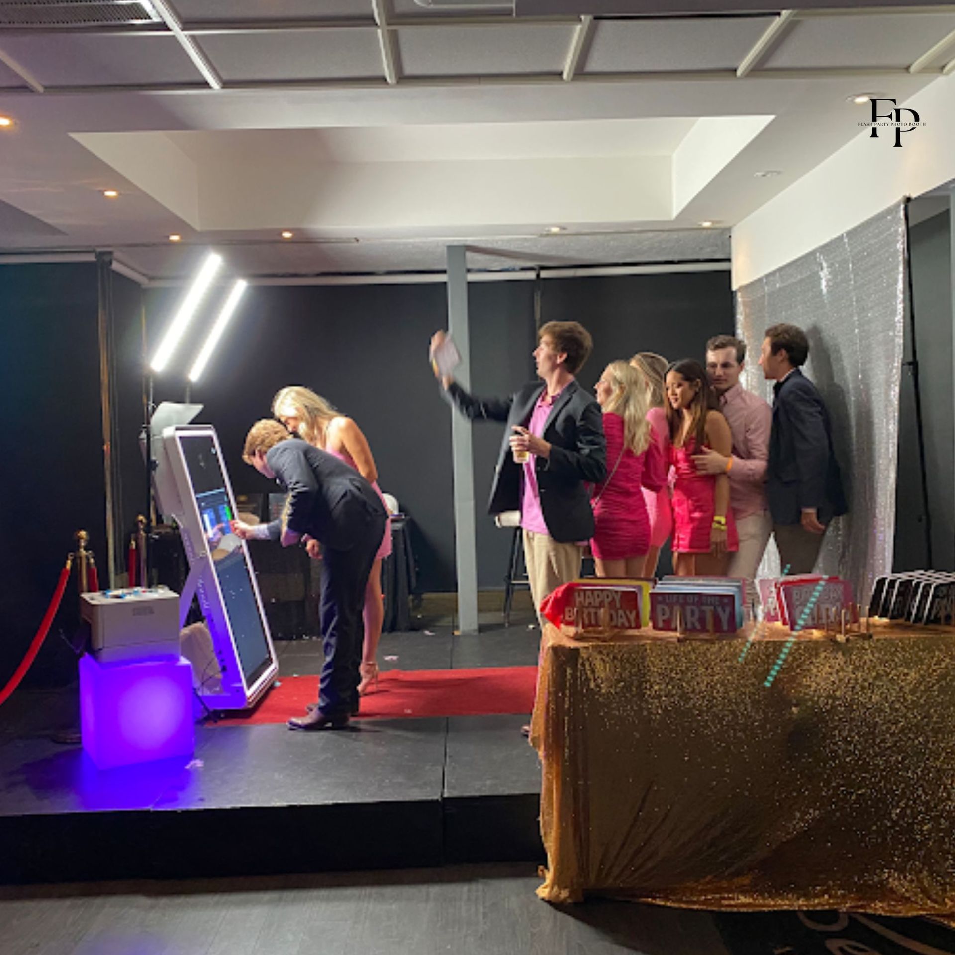 Guests enjoy the Mirror Photo Booth at a corporate event.