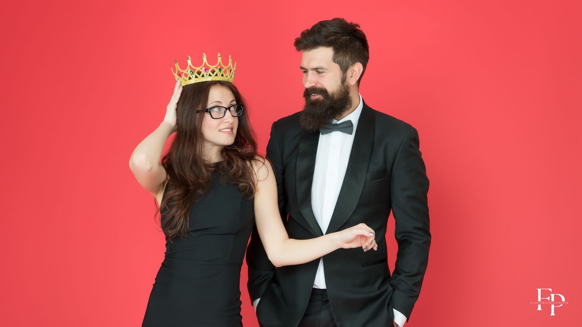 A couple posing at a photo booth set up at a corporate event in Houston