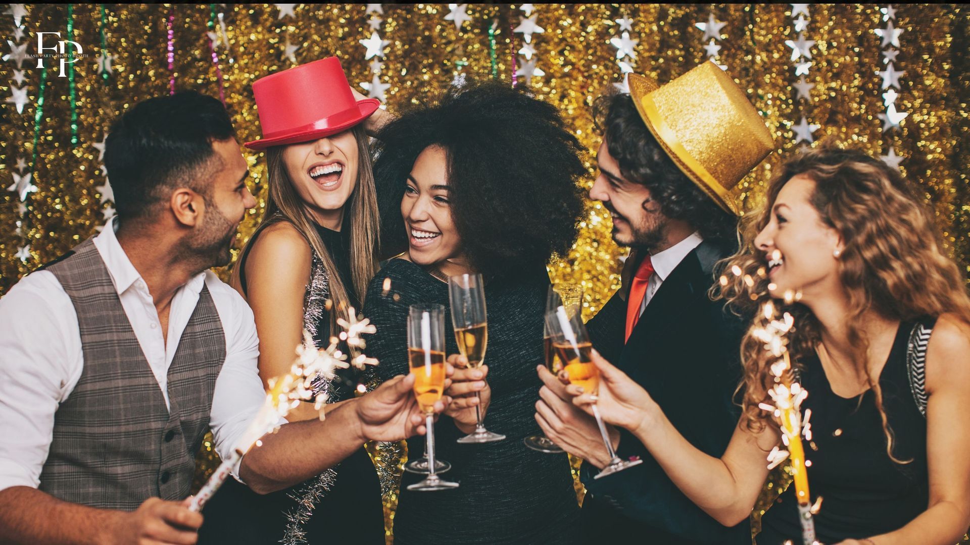 A group of friends posing, having fun, and partying with a sparkling background