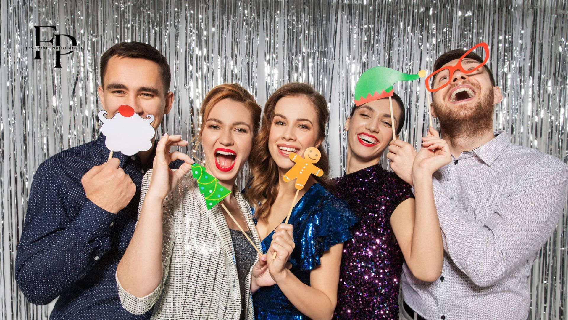 Guests holding their props while posing for a photo when celebrating their company's year-end party