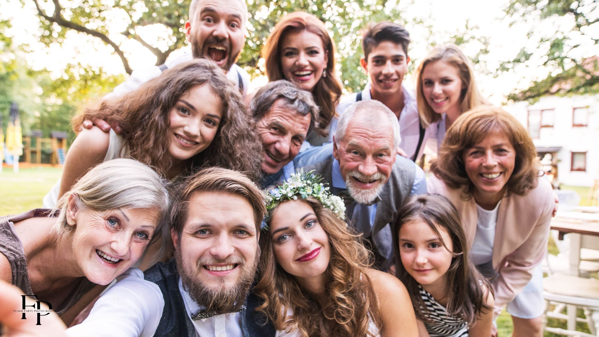 Bride and groom surrounded by families and friends during their wedding day