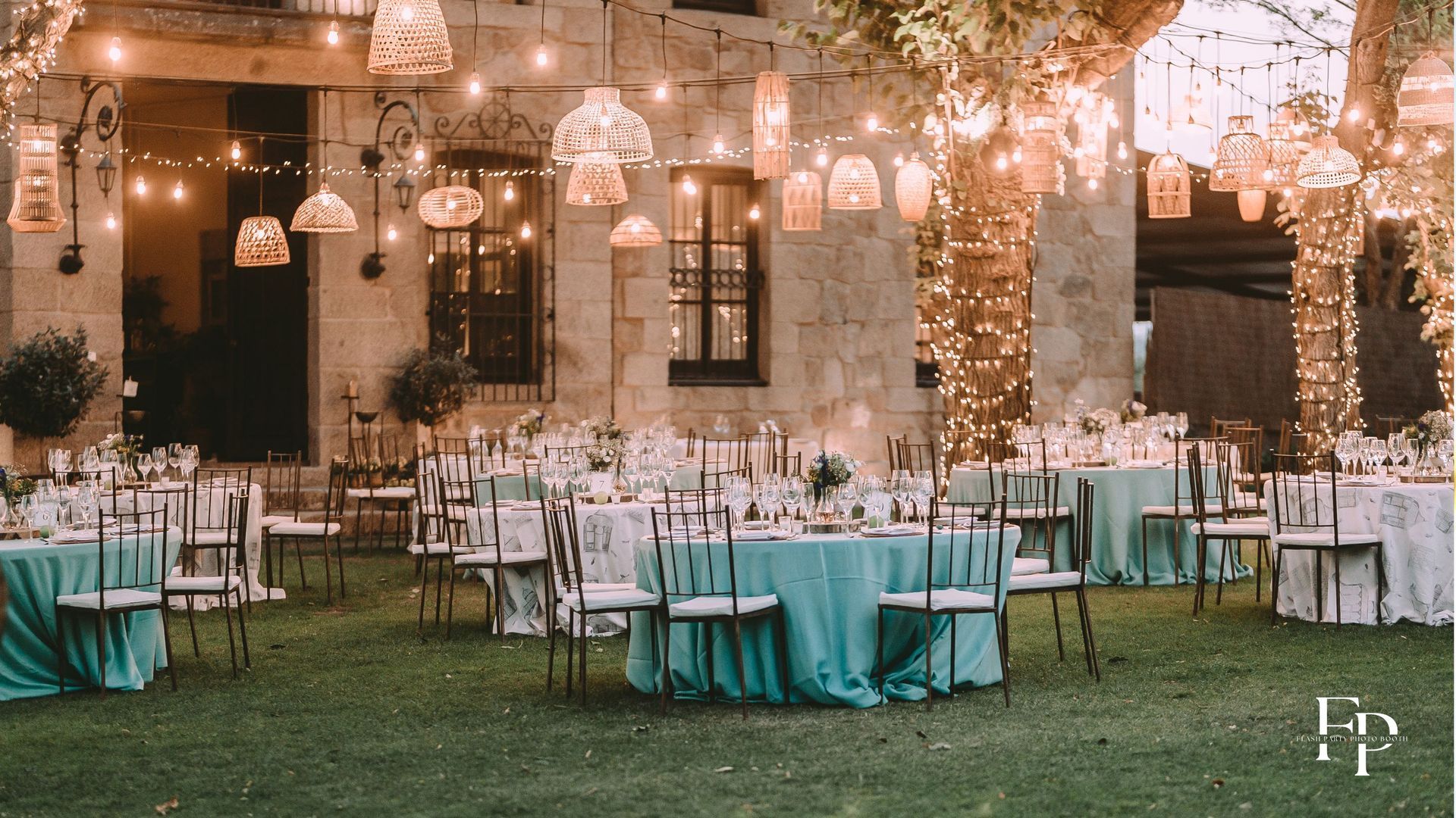 A beautiful arrangement of tables and chairs adorned with centerpieces for a wedding in Manor