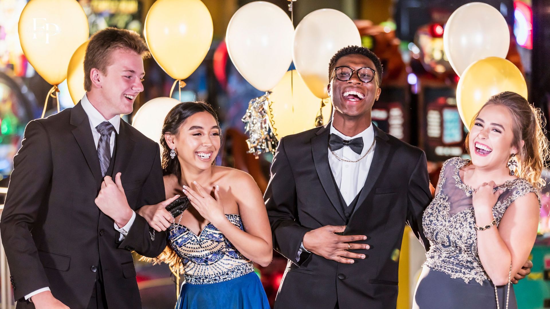 A group of friends enjoying and posing at a beautifully set up prom venue in Mansfield