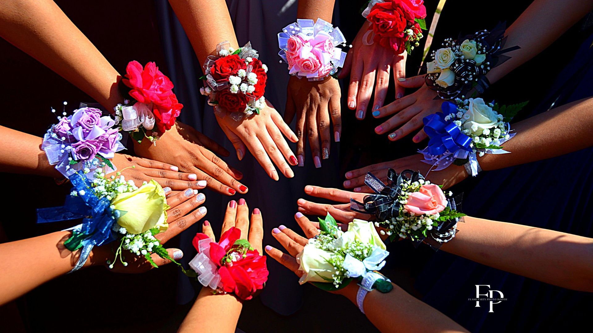 Sugar Land prom-goers form a circle with their hands with delicate corsages