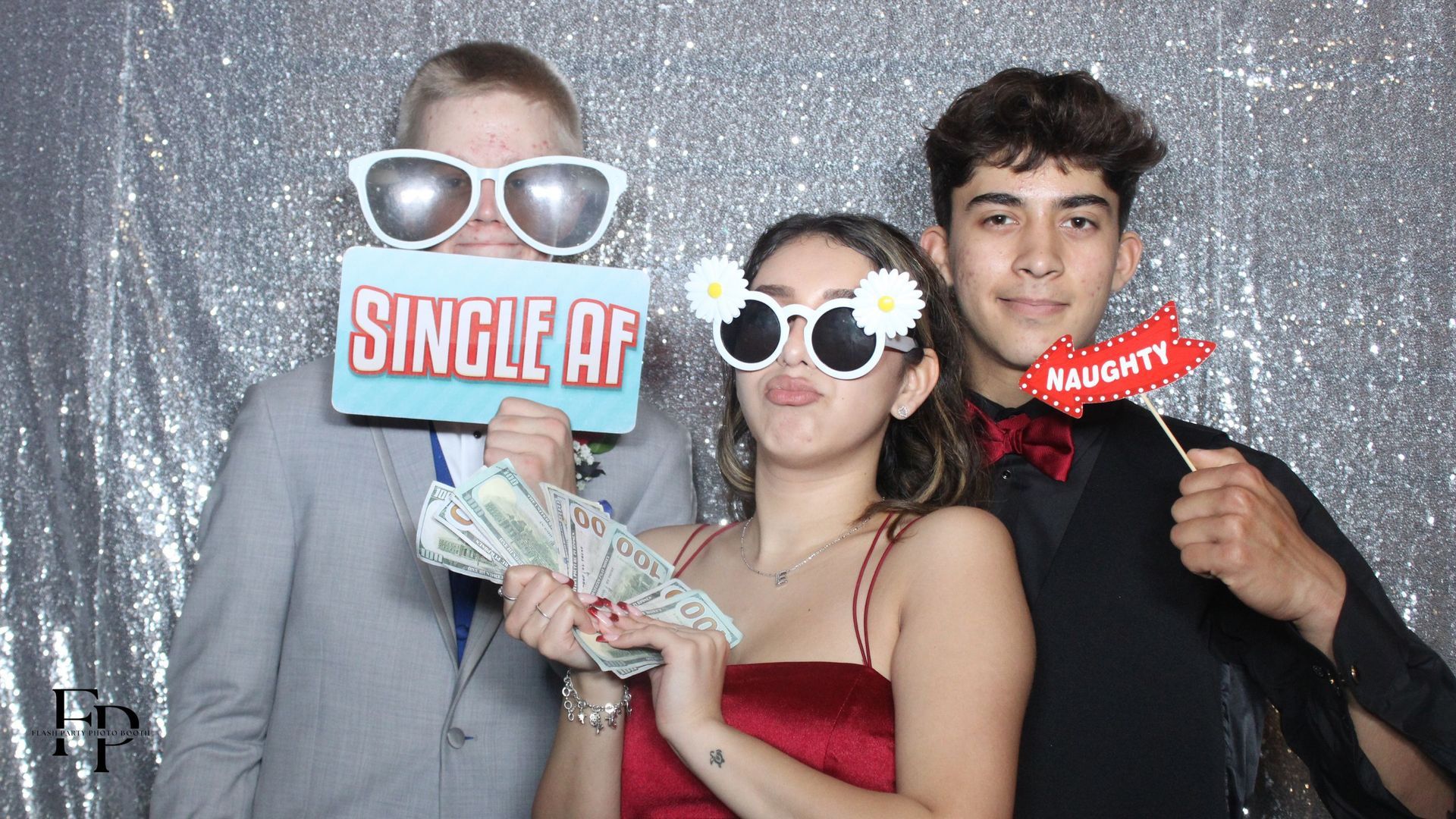 Prom attendees strike a pose in Overhead 360 Photo Booth.