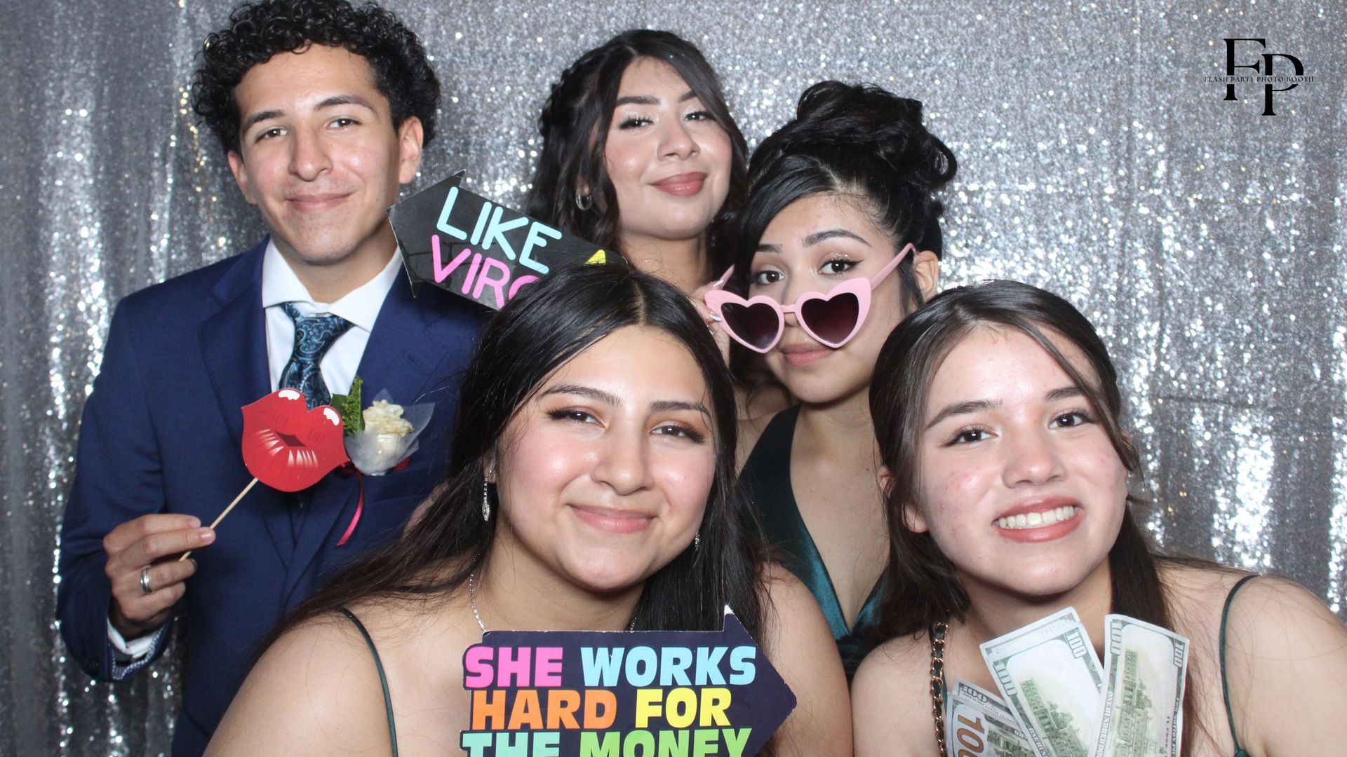 Prom goers take spontaneous pictures in Roamer Photo Booth.