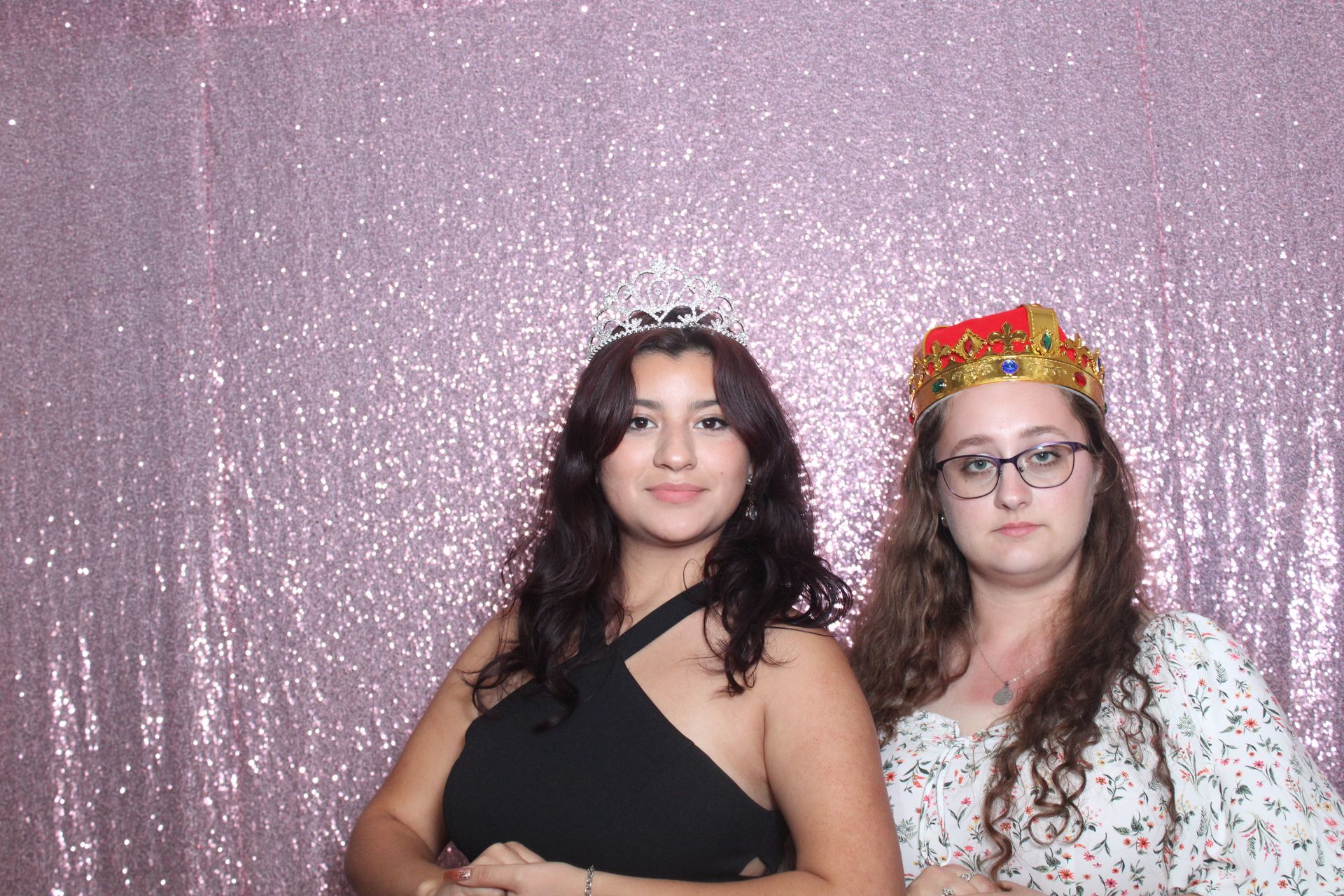 Two women at the Quinceañera event posing for a picture in the Cloee Photo Booth.