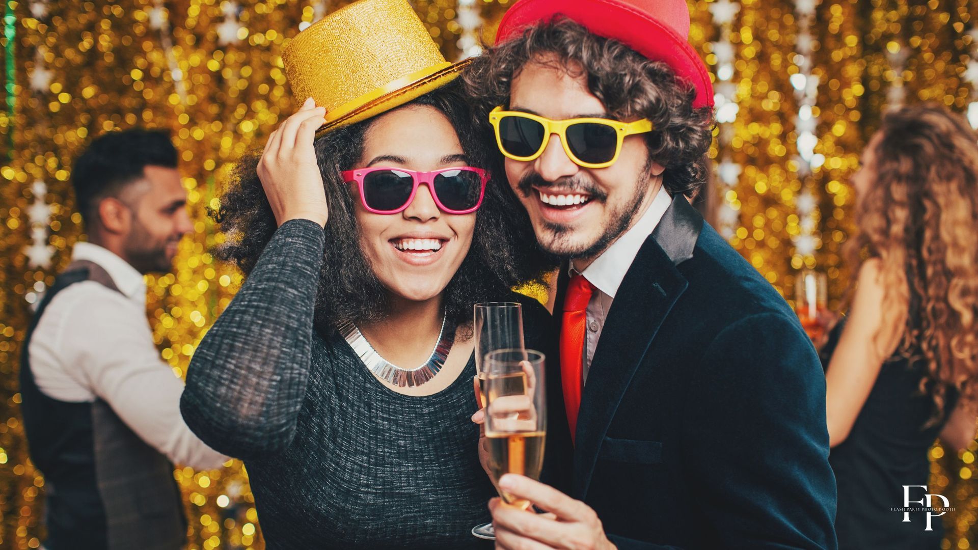 A young man and woman celebrate their graduation with props and a photo booth rental in Waco.