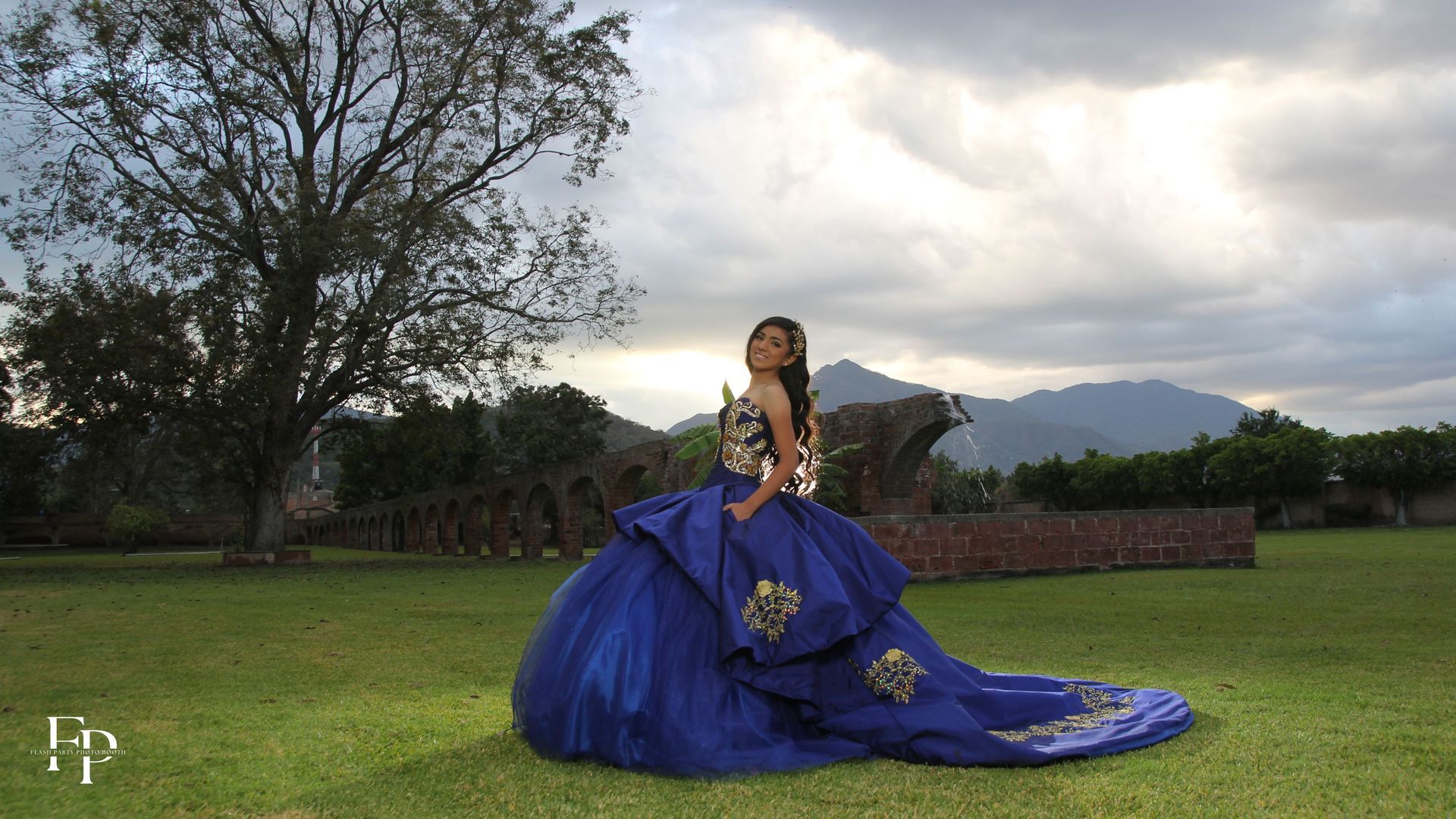 A quinceanera celebrant in a blue gown at her venue at Midland