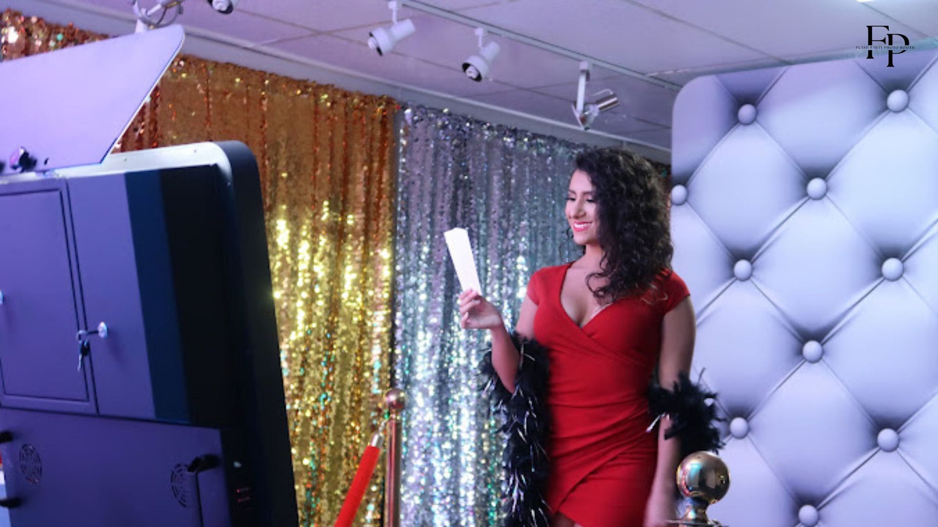 Birthday celebrant poses in a smart mirror photo booth at the Frisco event.