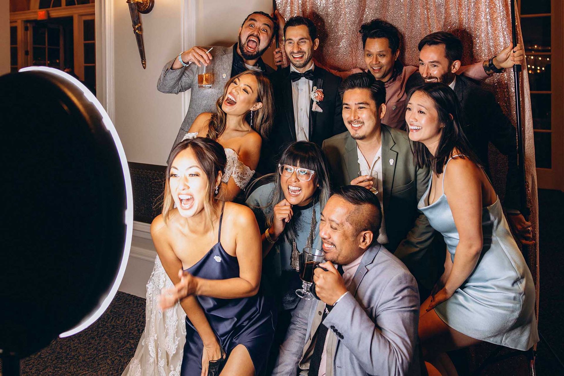 Bride's friends posing for a photo using an iPad selfie photo booth rental at a wedding reception in Atlanta, 