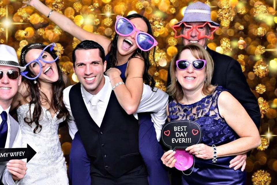 friends partying and posing at a photo booth rental in Midland. Our premier iPad Selfie Photo Booth is perfect for your event in Midland!