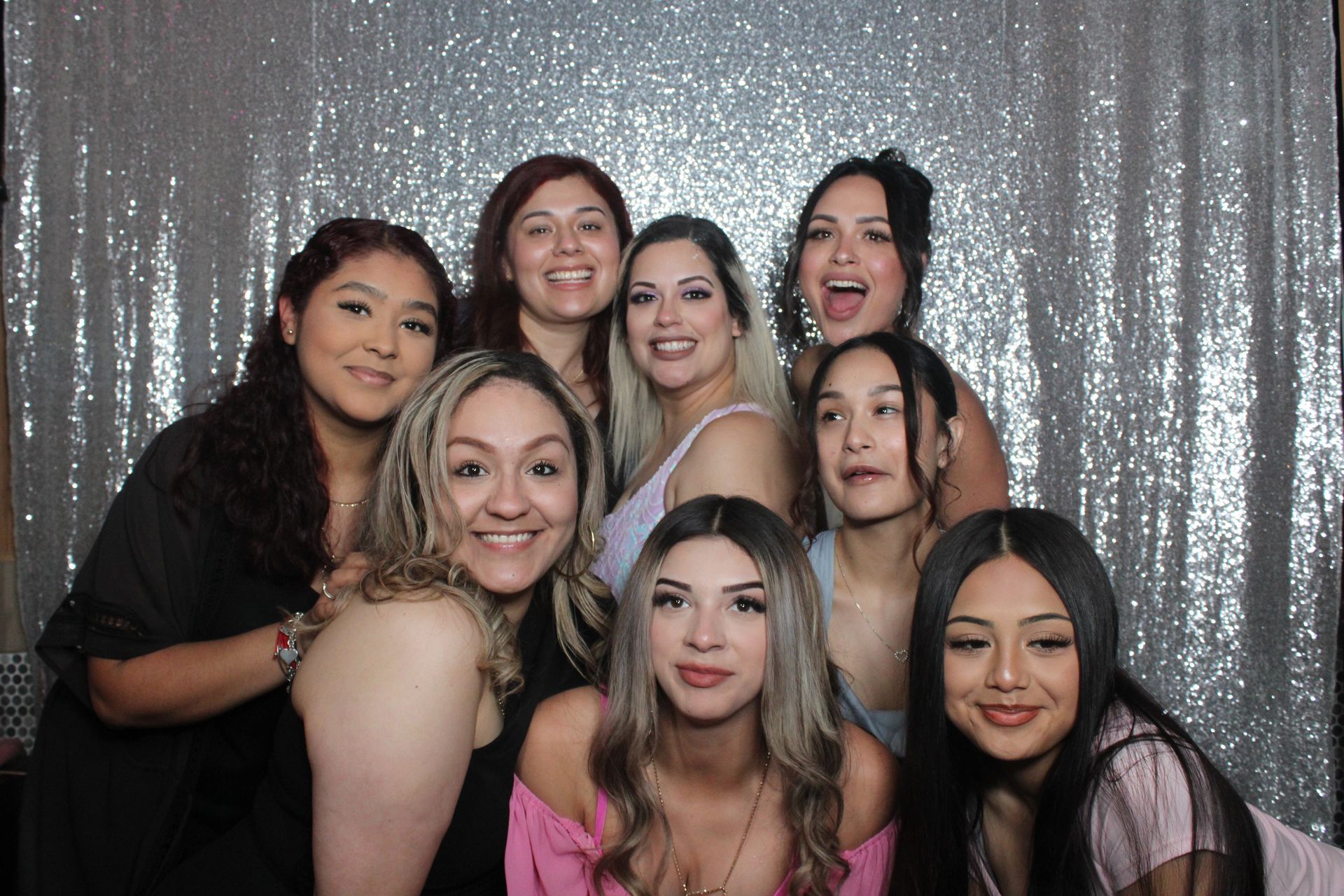 party group posing for a photo using a photo booth rental in San Jose California