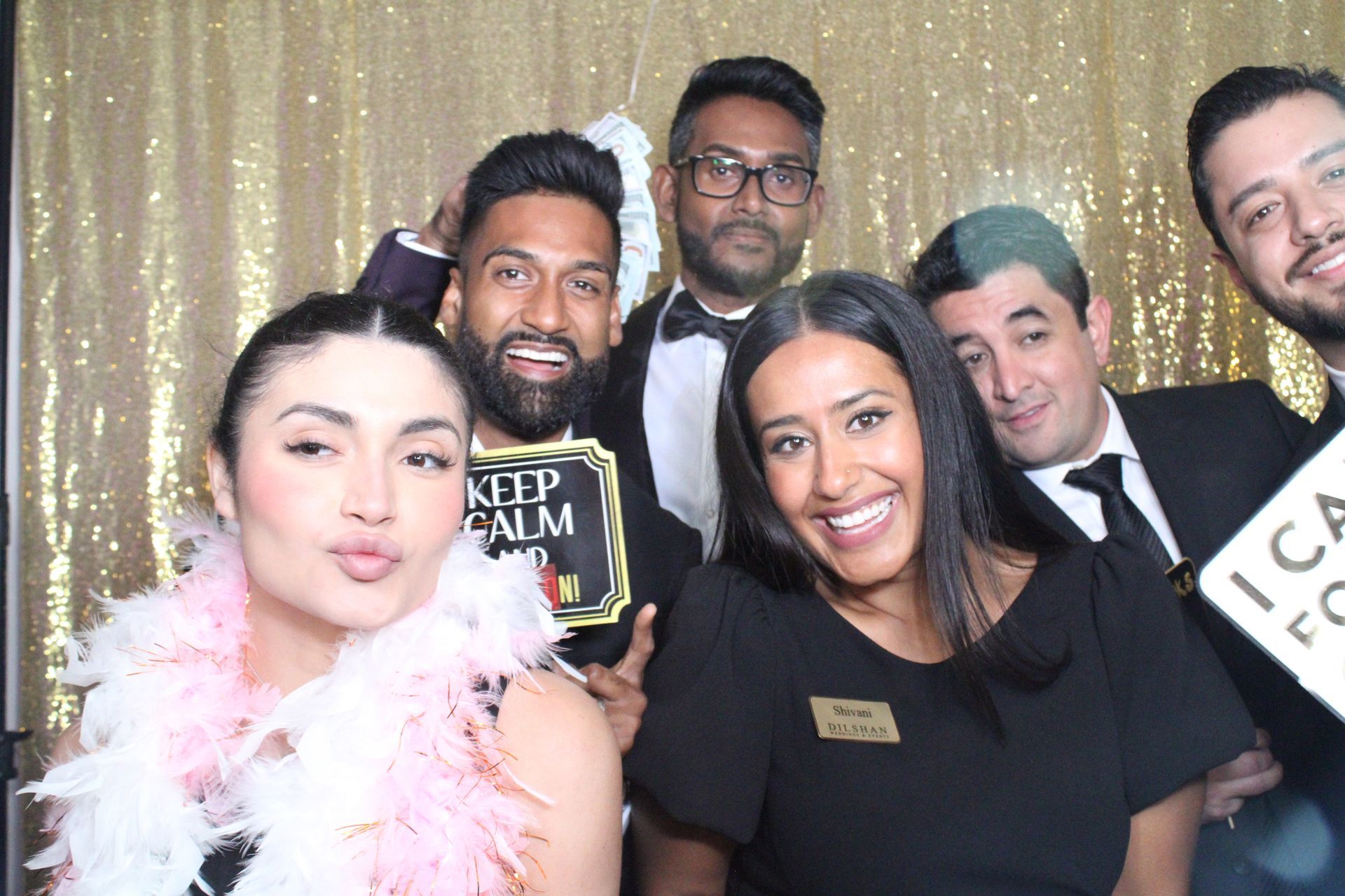 Group of friends having fun with photo booth rental at San Antonio event
