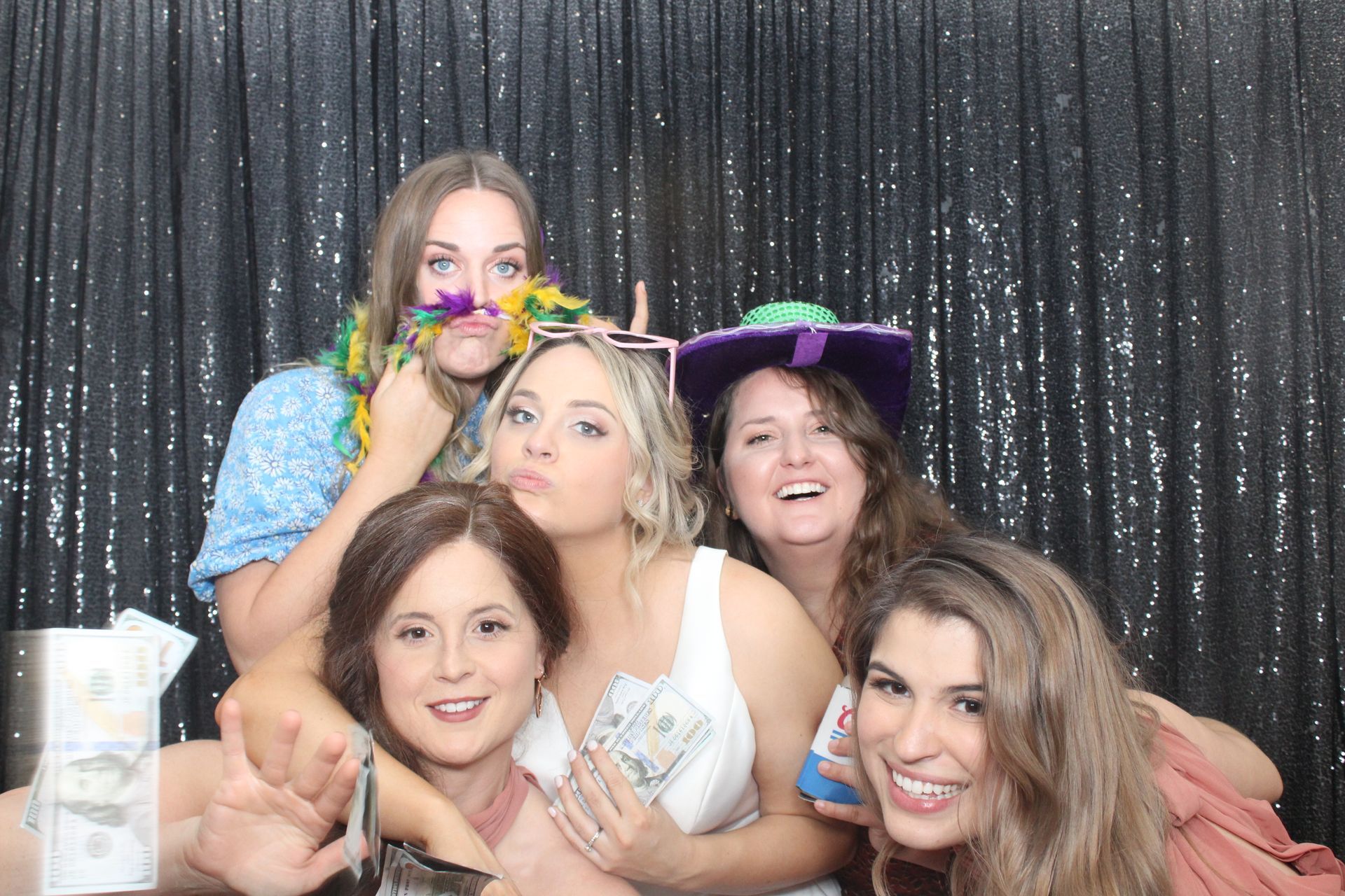 Wedding guest has fun posing with photo booth in Frisco