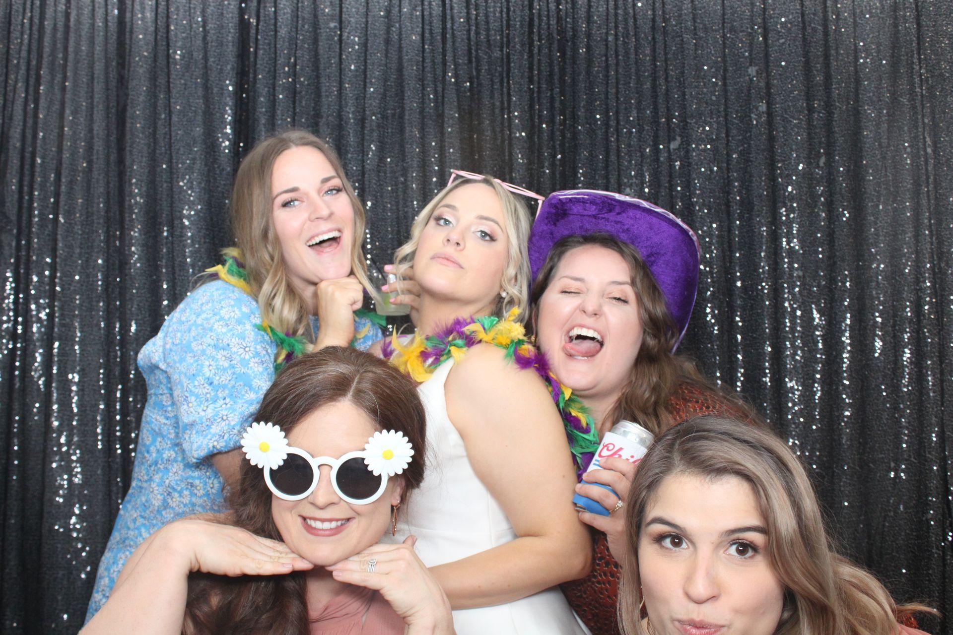 party group posing for a photo using a photo booth rental in Houston Texas