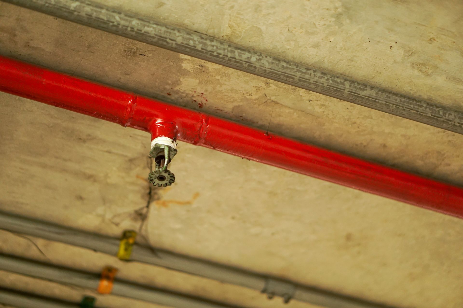 Automatic fire sprinkler system on the ceiling, red water pipe system. Automatic fire sprinkler system on the ceiling, red water pipe system.