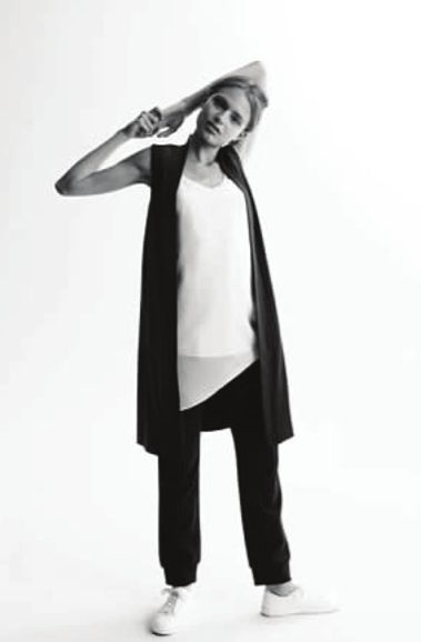 Black and White Photo of a Woman Stretching 