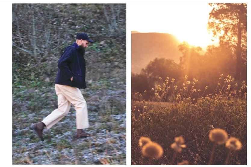 Man in dark jacket and light pants walking on a hillside. Beside it, a field in golden sunset.