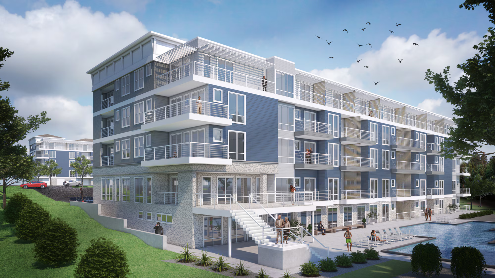 Modern blue and grey apartment building with balconies overlooking a pool. People on the patio.