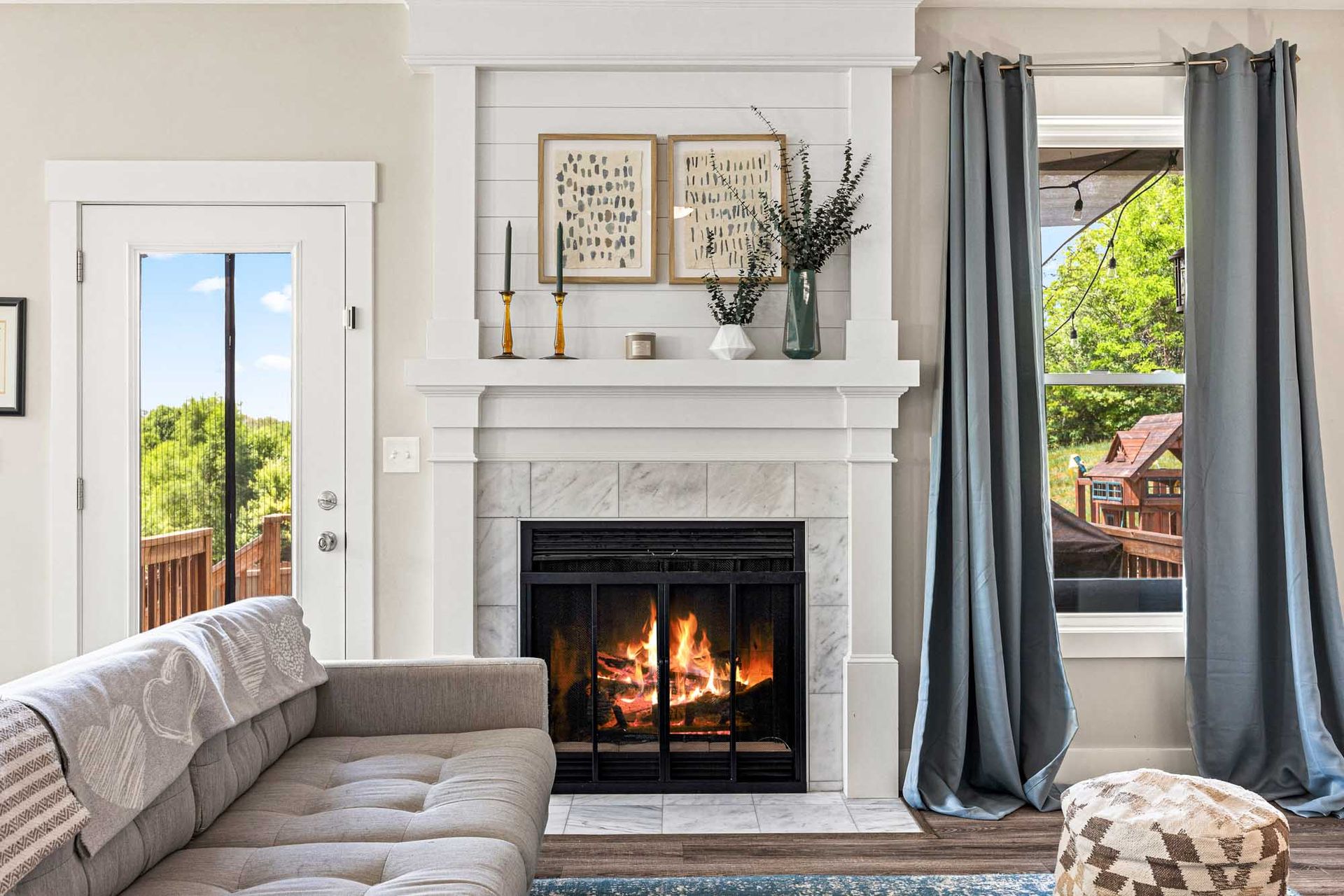 A living room with a fireplace and a couch.