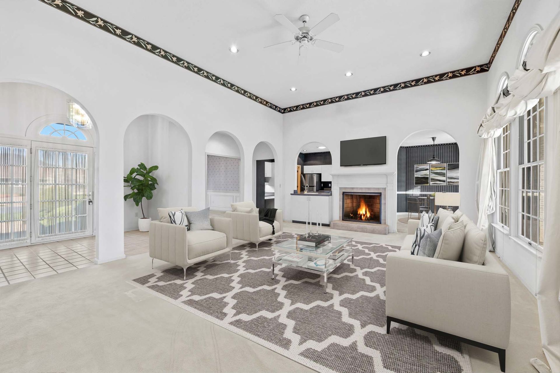 A living room filled with furniture and a fireplace.