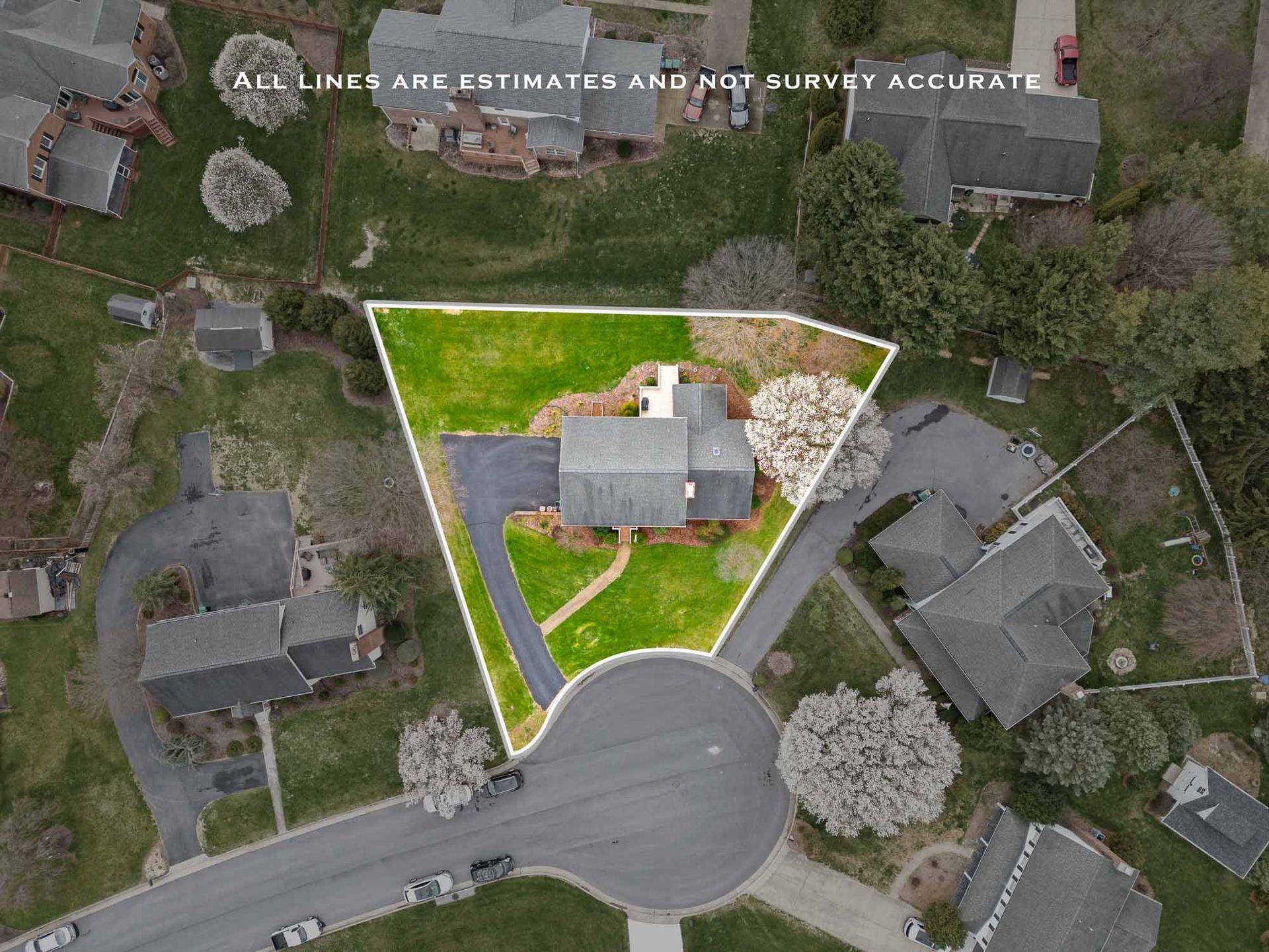An aerial view of a house in a residential area